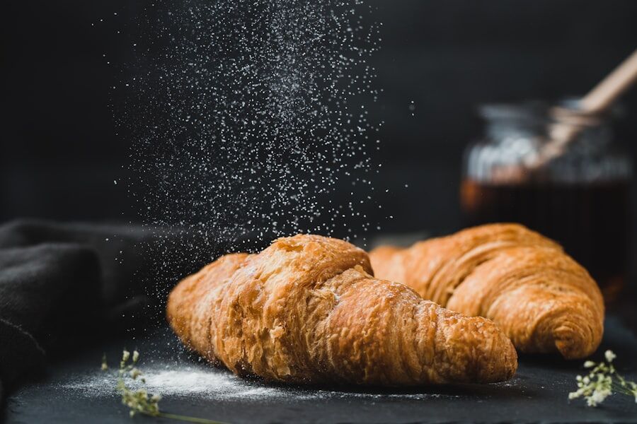 Fresh croissants dusted with icing sugar